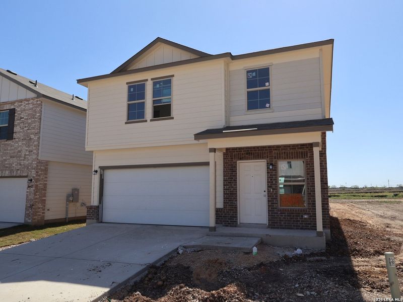 Front exterior of a new home in Paloma Park, Converse, TX, highlighting curb appeal (Image 18).