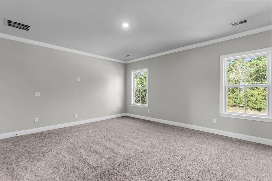 Spacious, unfurnished interior of a new home in Tidewater at Lakes of Cane Bay, Summerville (Image 21).