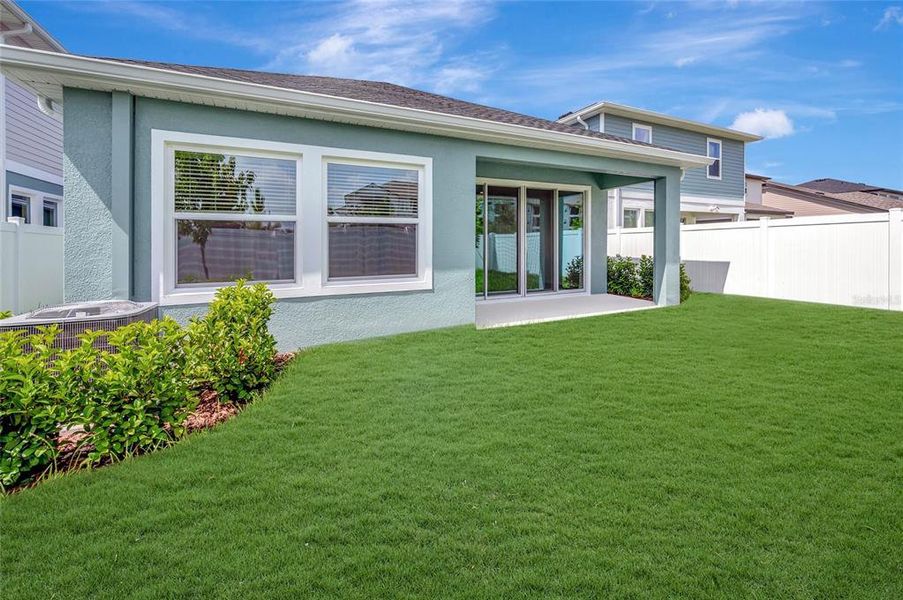 Exterior details and patio area of a home in Chapel Crossings - Garden Series, Wesley Chapel (Image 15).