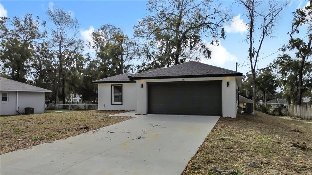 Front exterior of a new home in , Ocala, FL, highlighting curb appeal (Image 20).