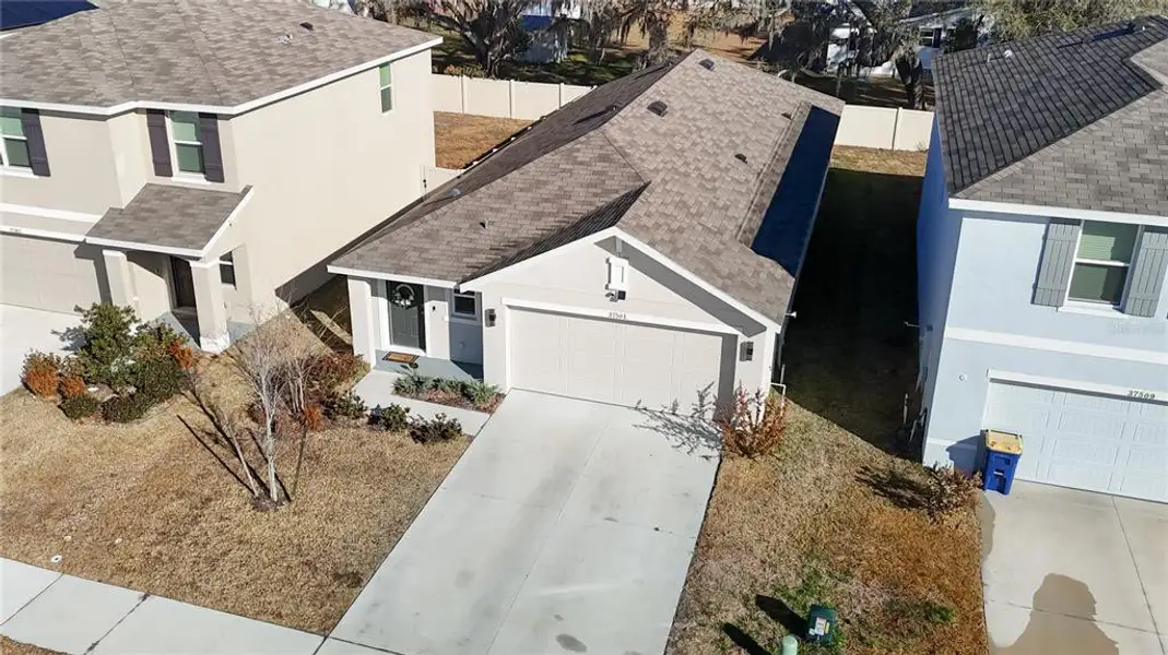 Front exterior of a new home in , Zephyrhills, FL, highlighting curb appeal (Image 24).
