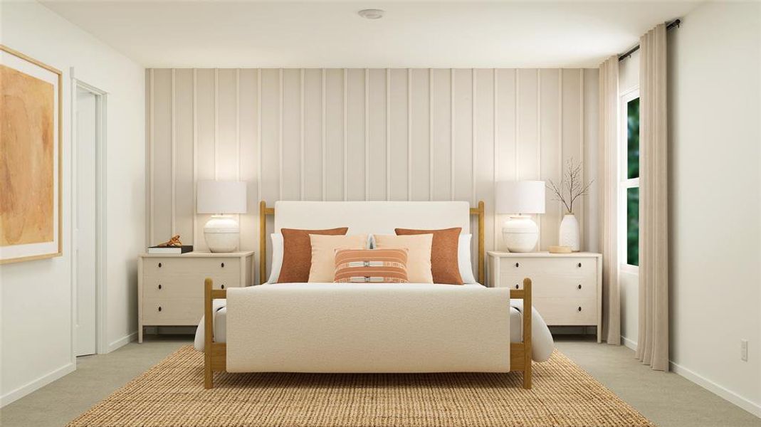 Bedroom featuring light colored carpet and baseboards