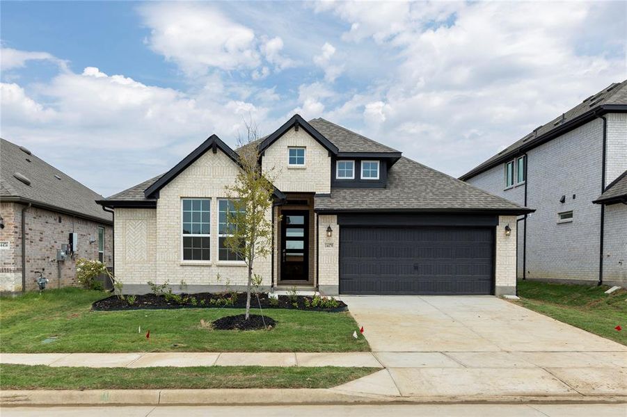 Front exterior of a new home in Creekview Meadows, Pilot Point, TX, highlighting curb appeal (Image 2).