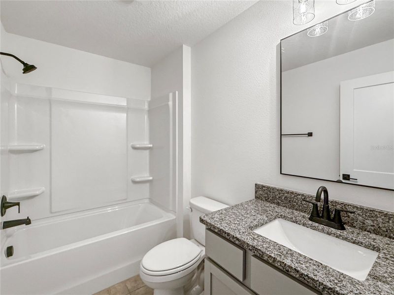 Furnished interior view inside a new home in Harmony Central, St. Cloud (Image 7).