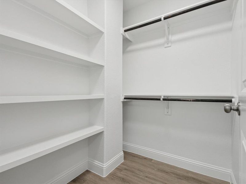 Walk in closet featuring hardwood / wood-style floors