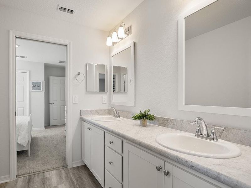 Bedrooms 3 and 4 share a Jack-and-Jill bath. Bedrooms 3 and 4 share a Jack-and-Jill bath.