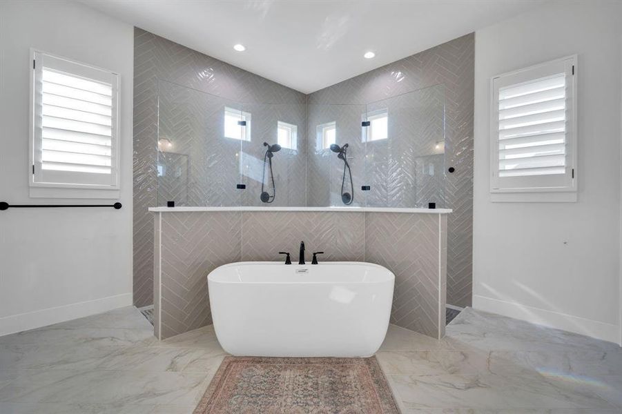 Incredible oversized shower with double heads and soaking tub.