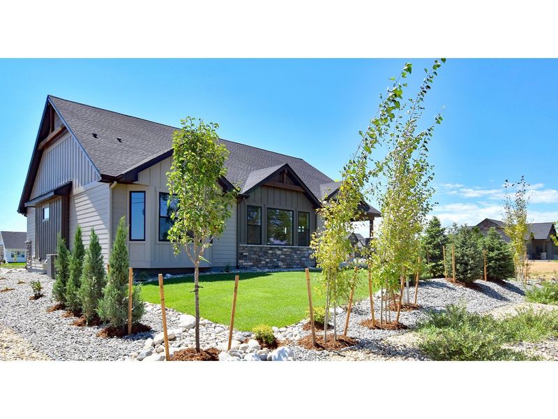 Front exterior of a new home in Harvest Ridge, Berthoud, CO, highlighting curb appeal (Image 27).