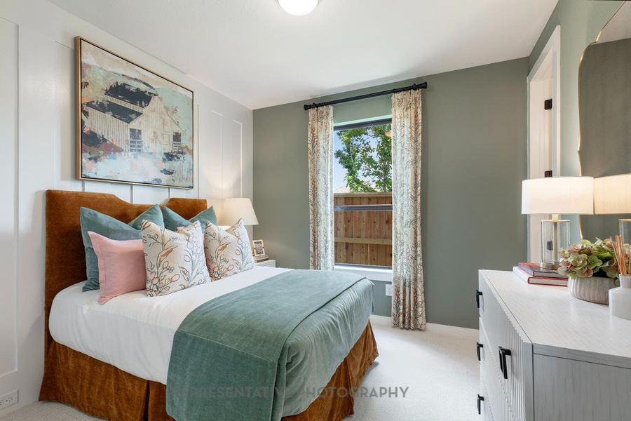 Bedroom featuring light colored carpet Bedroom featuring light colored carpet