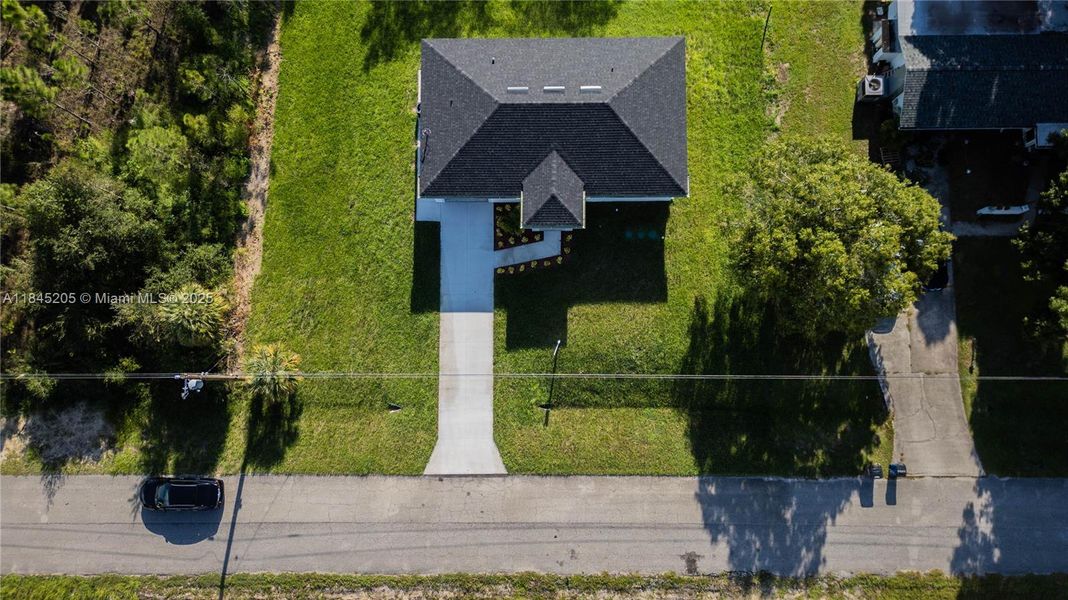 Front exterior of a new home in , Lehigh Acres, FL, highlighting curb appeal (Image 18). Front exterior of a new home in , Lehigh Acres, FL, highlighting curb appeal (Image 18).