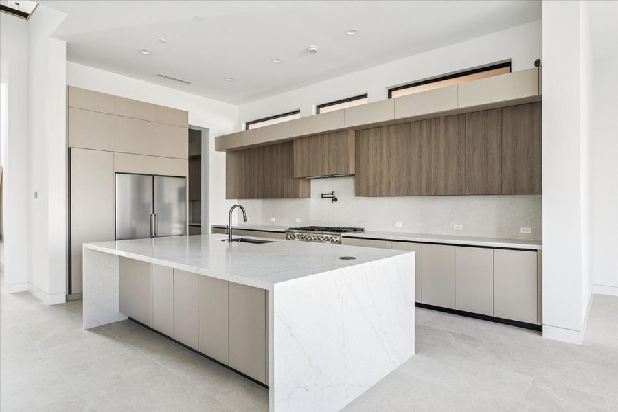 The island has cabinetry built into it for extra storage space.