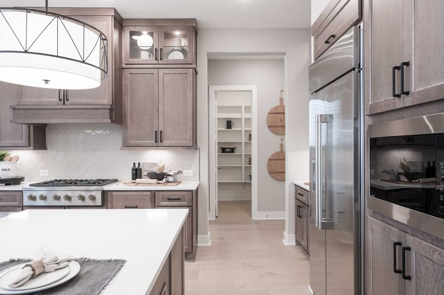 Representative furnished interior of a home built from the Milan by Tri Pointe Homes in Dunham Pointe, Cypress (Image 41).