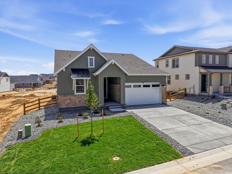 Front exterior of a new home in The Town Collection at Independence, Elizabeth, CO, highlighting curb appeal (Image 1). Front exterior of a new home in The Town Collection at Independence, Elizabeth, CO, highlighting curb appeal (Image 1).