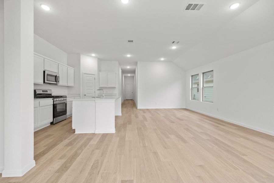 Kitchen and Dining Area in the Quartz home plan by Trophy Signature Homes – REPRESENTATIVE PHOTO