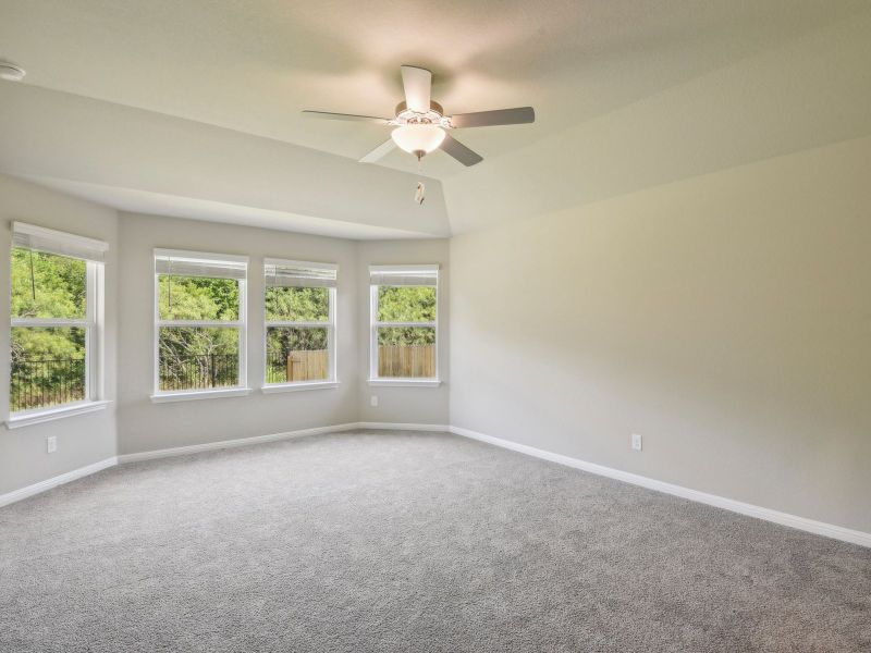 Take advantage of all the natural lighting in the primary bedroom.