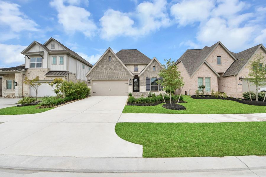 Front exterior of a new home in Bridgeland, Cypress, TX, highlighting curb appeal (Image 22). Front exterior of a new home in Bridgeland, Cypress, TX, highlighting curb appeal (Image 22).