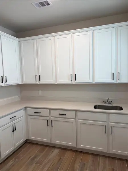 This oversized laundry area delivers the perfect blend of convenience, storage, and functionality—with a dedicated sink!