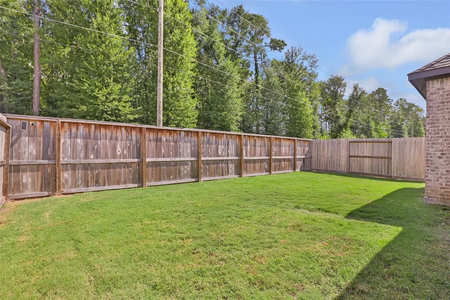 Exterior details and patio area of a home in The Highlands, Porter (Image 29).