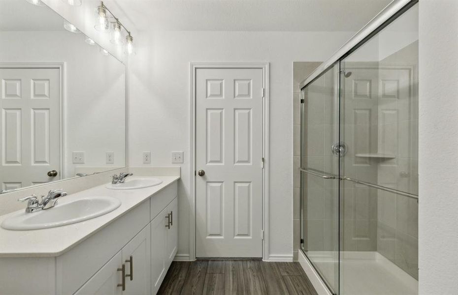 Spacious owner's bathroom with oversized shower *real home pictured