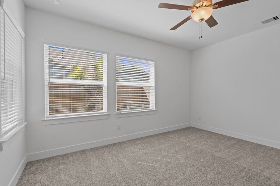 Representative unfurnished interior of a home built from the Carriagehouse by Chesmar Homes in Meridiana Townhomes, Iowa Colony (Image 76).