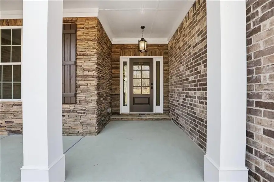 Exterior details and patio area of a home in Bradley Gin, Monroe (Image 4).