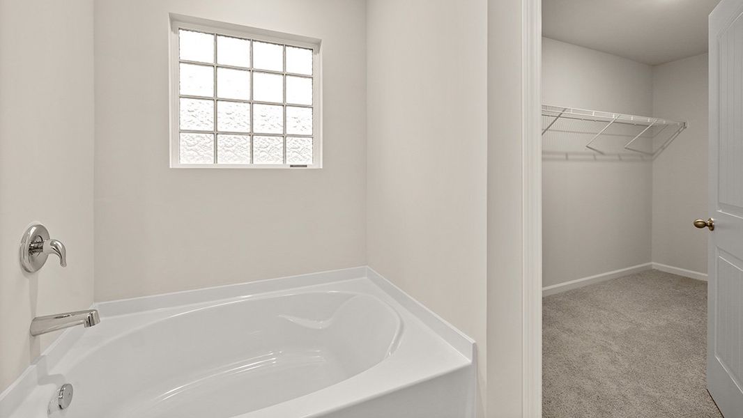 Representative furnished interior of a home built from the Mansfield by D.R. Horton in Northwoods at Mirror Lake, Villa Rica (Image 14).