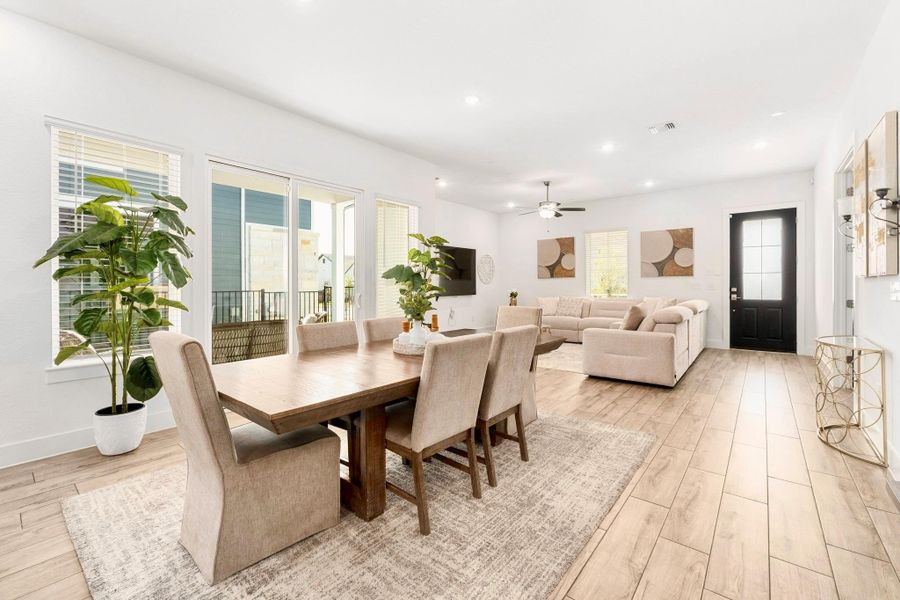 Dining area seperate from living space & french doors heading out to the side covered porch.