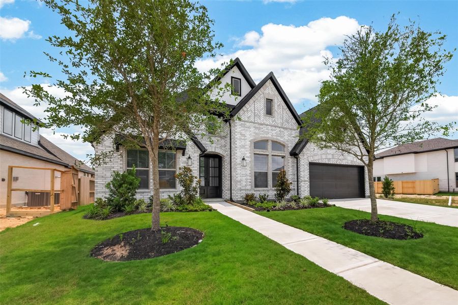 Front exterior of a new home in , Richmond, TX, highlighting curb appeal (Image 28).
