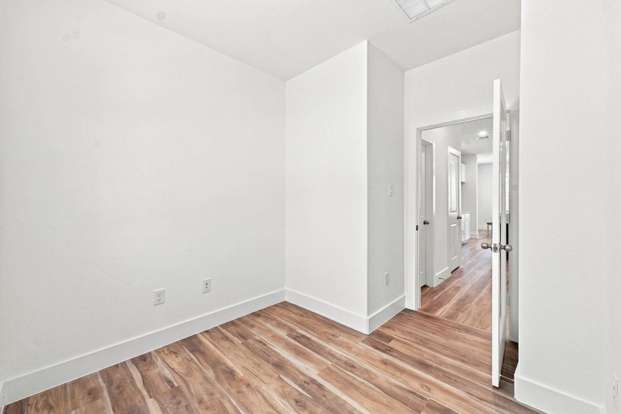 Private dedicated office with natural light and wood-look flooring, providing a comfortable, functional space for working or studying from home. Private dedicated office with natural light and wood-look flooring, providing a comfortable, functional space for working or studying from home.