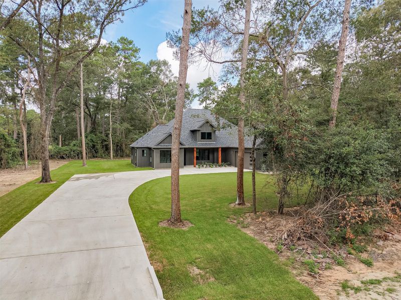 Front exterior of a new home in , Plantersville, TX, highlighting curb appeal (Image 24).