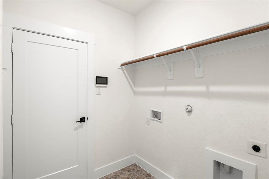 Laundry area featuring hookup for a gas dryer, electric dryer hookup, and hookup for a washing machine