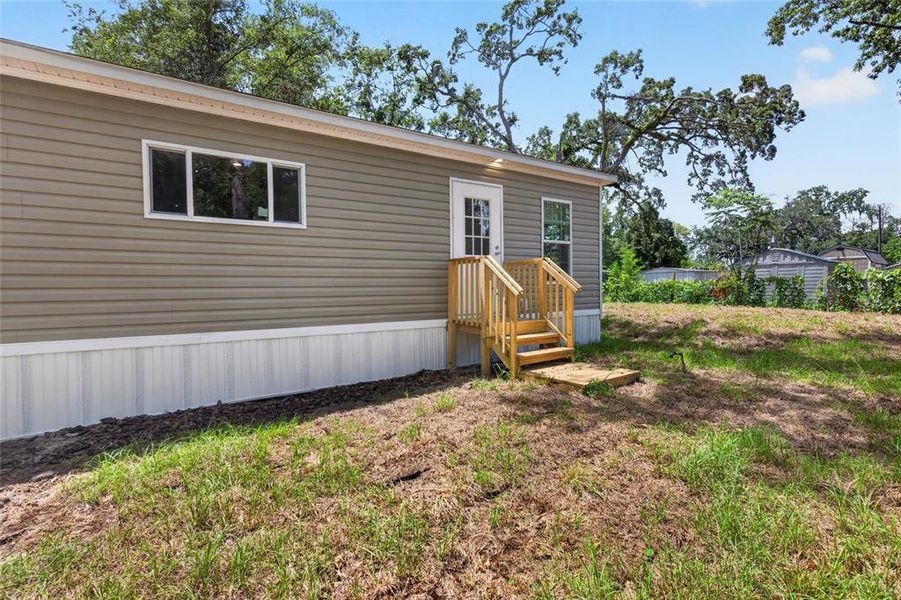 Exterior details and patio area of a home in , Brooksville (Image 23).
