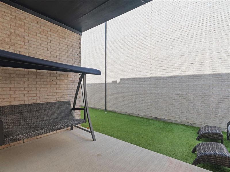 Exterior details and patio area of a home in Village on Main Street, Frisco (Image 25).