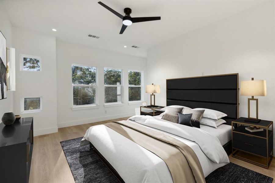 Bedroom with ceiling fan and light hardwood / wood-style flooring