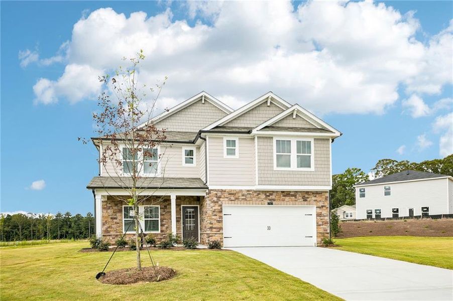 Front exterior of a new home in Northwoods at Mirror Lake, Villa Rica, GA, highlighting curb appeal (Image 26). Front exterior of a new home in Northwoods at Mirror Lake, Villa Rica, GA, highlighting curb appeal (Image 26).