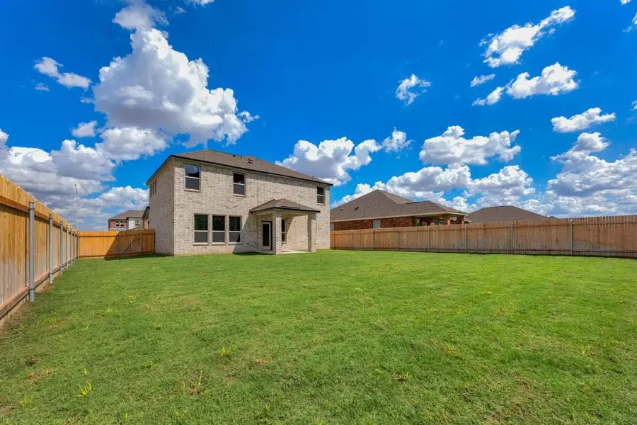 Exterior details and patio area of a home in Mustang Valley, Manor (Image 23).