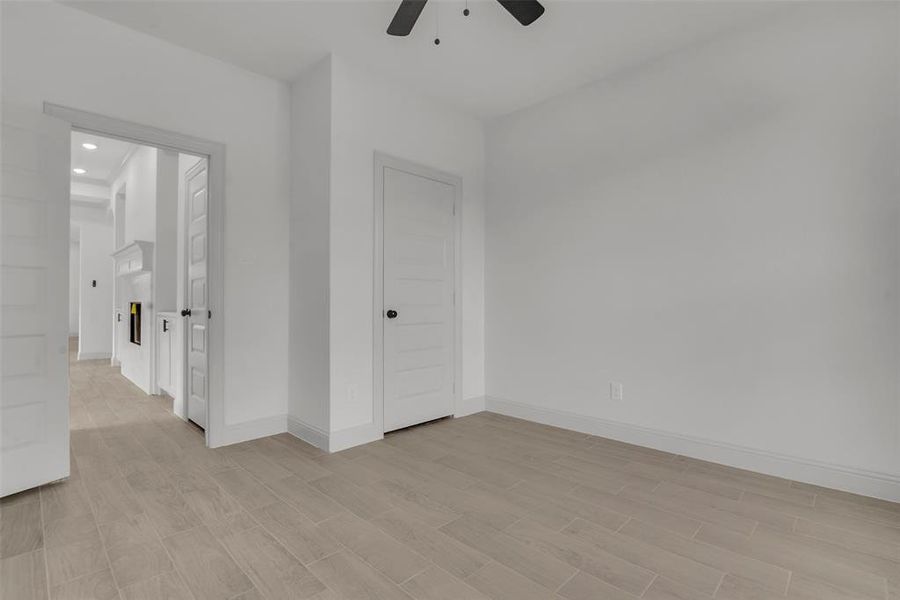 Unfurnished room with a ceiling fan, light wood-type flooring, and recessed lighting Unfurnished room with a ceiling fan, light wood-type flooring, and recessed lighting