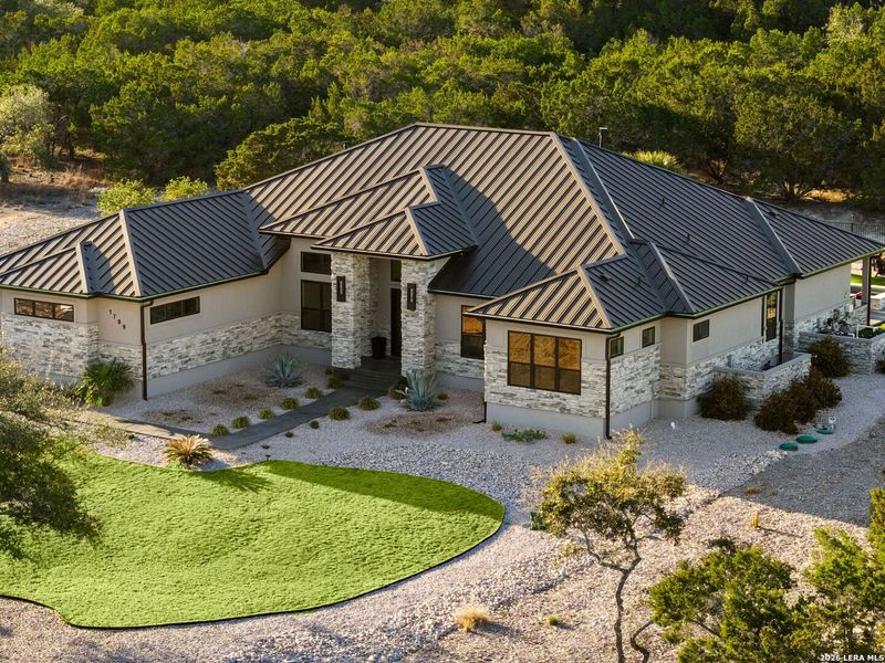 Front exterior of a new home in , Canyon Lake, TX, highlighting curb appeal (Image 24).