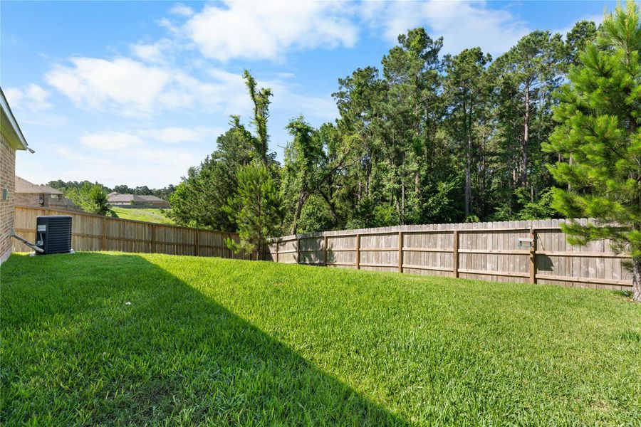 Private backyard with no rear neighbors and a peaceful wooded backdrop. Enjoy added privacy, green space, and relaxing views from your own fenced outdoor retreat Private backyard with no rear neighbors and a peaceful wooded backdrop. Enjoy added privacy, green space, and relaxing views from your own fenced outdoor retreat
