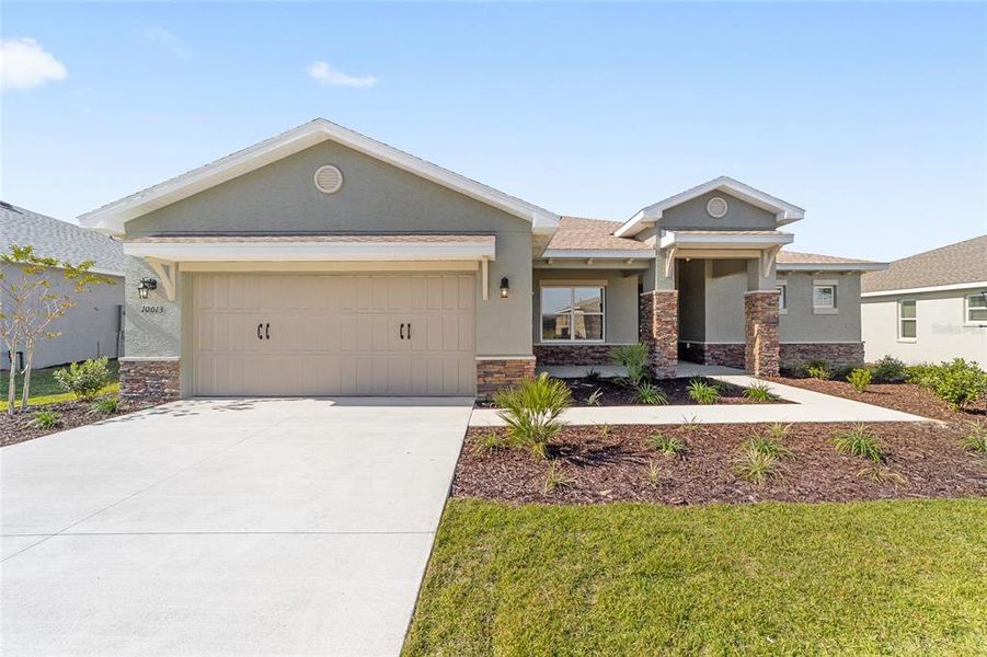 Front exterior of a new home in , Ocala, FL, highlighting curb appeal (Image 22). Front exterior of a new home in , Ocala, FL, highlighting curb appeal (Image 22).