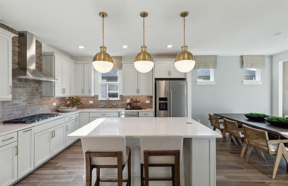 Spacious kitchen with oversized island *Photos of furnished model. Not actual home. Representative of floor plan. Some options and features may vary Spacious kitchen with oversized island *Photos of furnished model. Not actual home. Representative of floor plan. Some options and features may vary