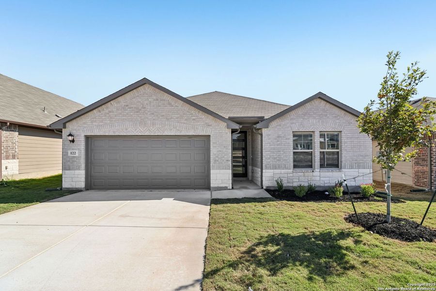 Front exterior of a new home in Legendary Trails - Classic Series, Cibolo, TX, highlighting curb appeal (Image 22). Front exterior of a new home in Legendary Trails - Classic Series, Cibolo, TX, highlighting curb appeal (Image 22).