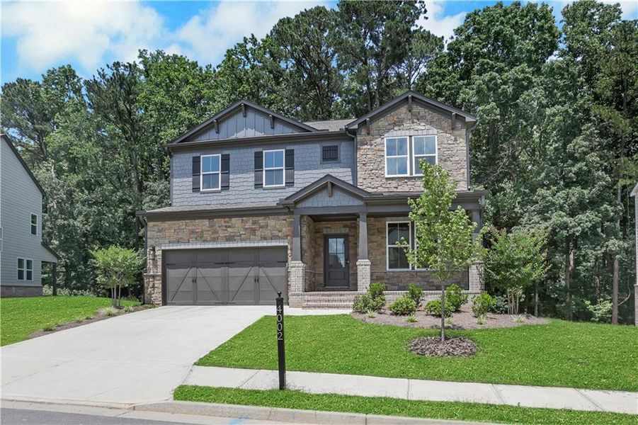 Front exterior of a new home in The Paddocks at Doc Hughes, Buford, GA, highlighting curb appeal (Image 2). Front exterior of a new home in The Paddocks at Doc Hughes, Buford, GA, highlighting curb appeal (Image 2).