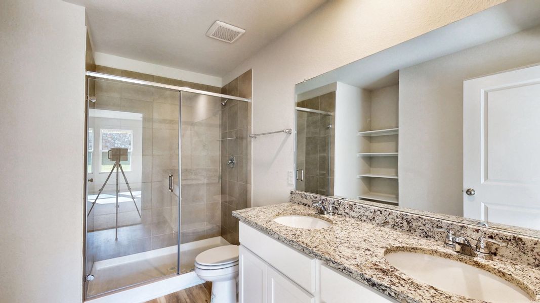 A bathroom with a glass shower.