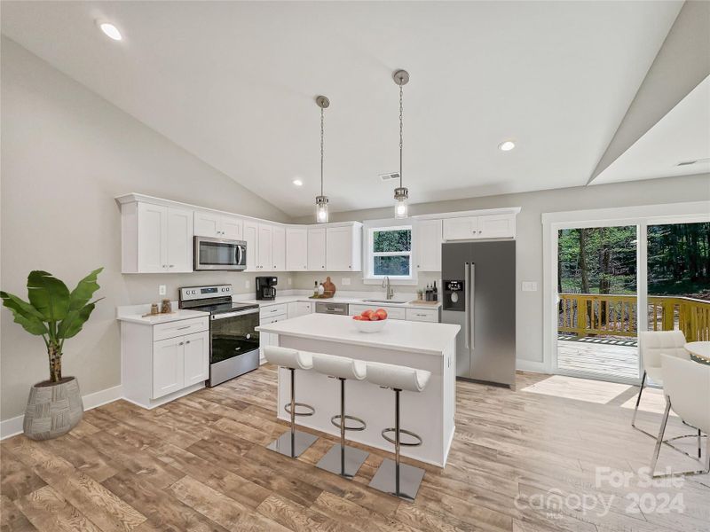 Beautiful kitchen with Island offering extra seating space *virtually staged