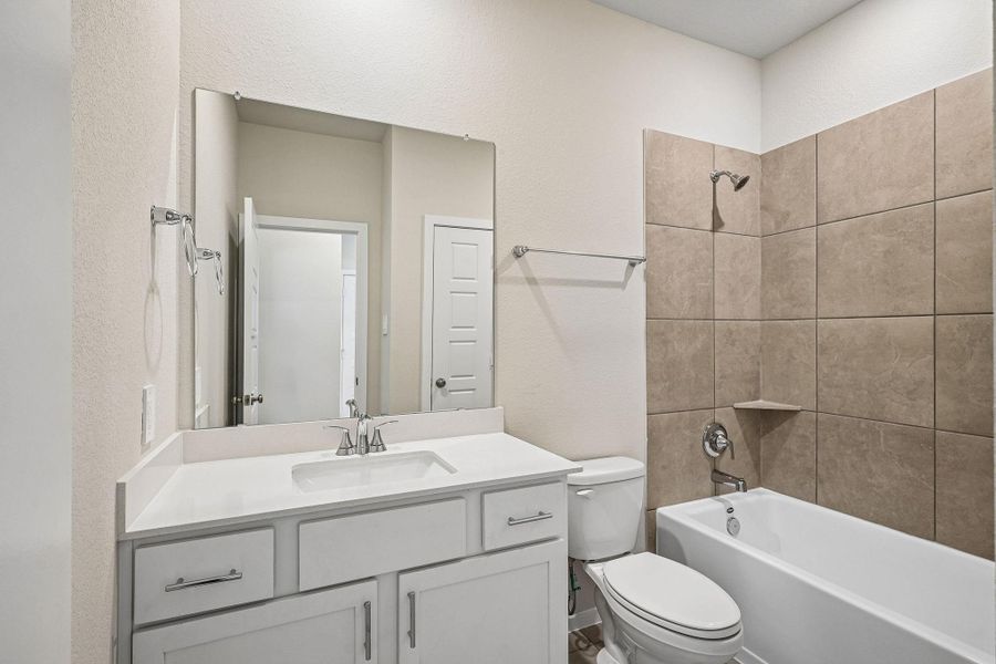 Furnished interior view inside a new home in Riviera Pines - Premier Series, Huffman (Image 10).