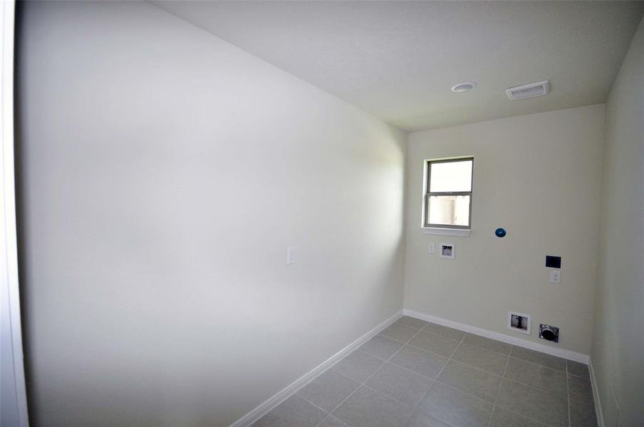 Utility room with space for more that just a washer and dryer.