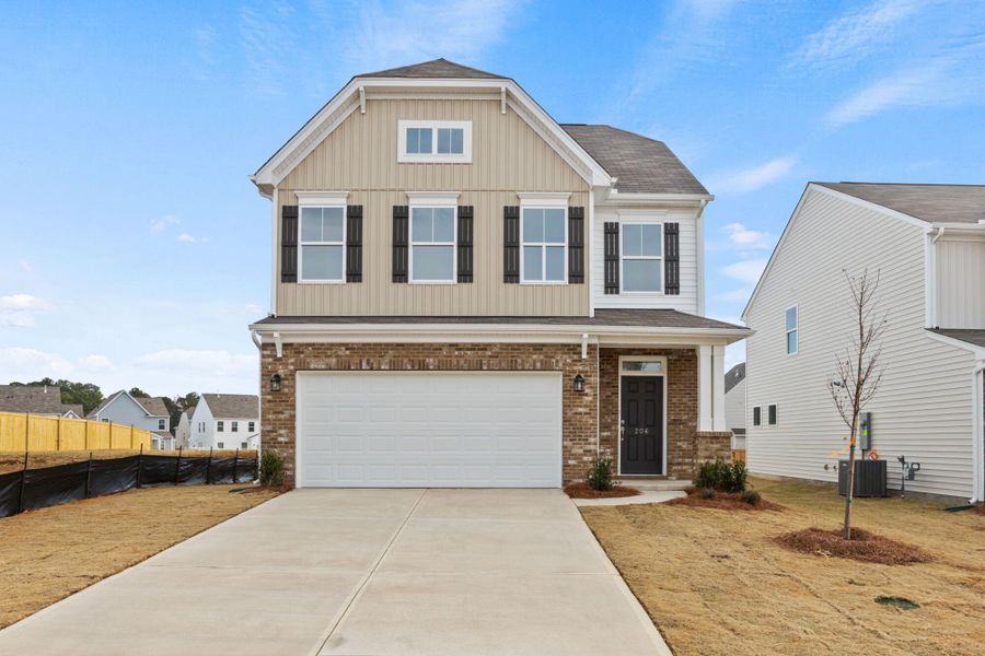 Front exterior of a new home in Harrington, Greenville, SC, highlighting curb appeal (Image 1). Front exterior of a new home in Harrington, Greenville, SC, highlighting curb appeal (Image 1).