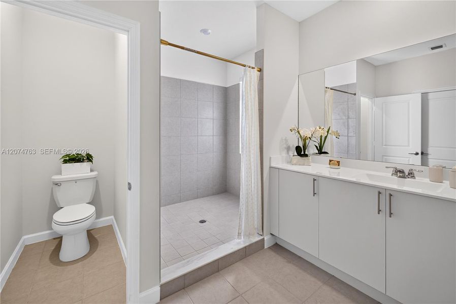 Furnished interior view inside a new home in Acacia Groves, Miami (Image 14).