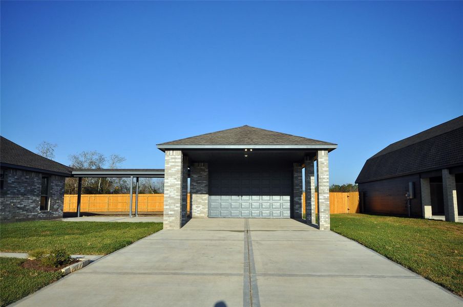 Front exterior of a new home in Pedregal, League City, TX, highlighting curb appeal (Image 20). Front exterior of a new home in Pedregal, League City, TX, highlighting curb appeal (Image 20).